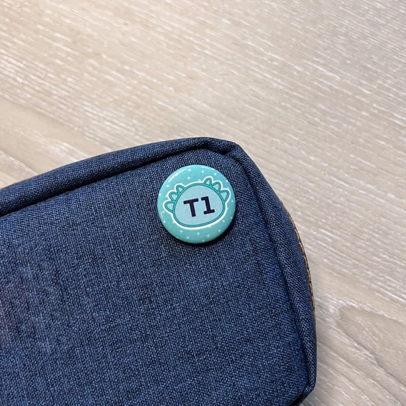 'T1' Printed Badge